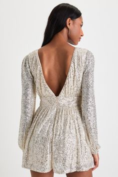 Get ready to be on the dance floor all night, because that's where the Lulus Watch Me Shine Champagne Sequin Plunge Long Sleeve Romper belongs! This stunning romper is composed of shiny silver sequins that sparkle across sheer mesh (atop a matching stretch knit liner), that shapes a plunging surplice neckline and long sleeves with elasticized cuffs. A high, banded waist sits atop a pair of breezy shorts. Turn around to reveal a flirty, deep V-back. Hidden back zipper/clasp. Fit: This garment fit Lulu Fashion, On The Dance Floor, Surplice Neckline, Silver Sequin, Sleeved Romper, Long Sleeve Romper, The Dance, Shiny Silver, Dance Floor