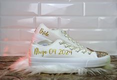 With these Handmade Bridal Sneakers, you will look fabulous. Just after your heels betray you at the wedding, get your bride custom flat shoes and keep dancing. Bedazzled with sequins, rhinestones, glitter, and other beautiful details.🌟Includes🌟- Pick shoelace colors.- The toe top is covered with bright rhinestones.- On the sides of the shoe, the idea/name/date is printed in solid or glitter color.🧡You will receive🧡- One pair of sneaker canvas off-brand- One special custom bag for the shoes? Lace-up Wedding Shoes With Rhinestones For Party, Low-top Glitter Sneakers For Wedding, Bride's Low-top Wedding Shoes With Rhinestones, Low-top Wedding Shoes With Rhinestones For Bride, Low-top Bride Wedding Shoes With Rhinestones, Unique Flat Shoes, Bride Shoes Flats, Bride Flats, Bridal Sneakers