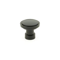 a black knob on a white background