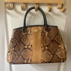 Lightly Used Elegant Brown Coach Satchel, Luxury Brown Coach Satchel, Brown Textured Leather Coach Bag, Coach Brown Textured Leather Bag, Luxury Snake Print Satchel Bag, Luxury Brown Snake Print Bags, Rectangular Leopard Print Shoulder Bag With Gold-tone Hardware, Python Snake, Elegant Leopard Print Bag With Gold-tone Hardware