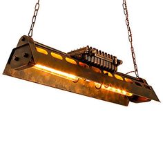 a light fixture hanging from chains with lights on it's sides and an object in the middle