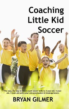 a group of young children standing next to each other on top of a lush green field