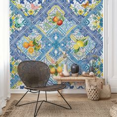 a blue and yellow wallpaper with oranges on it