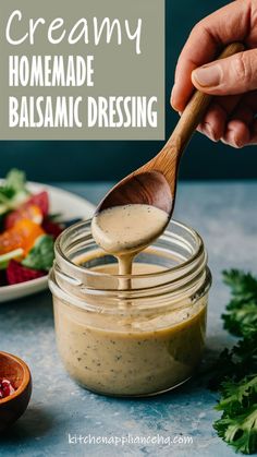 homemade balsamic dressing in a jar with a wooden spoon