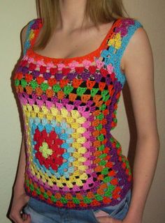 a woman wearing a colorful crocheted tank top