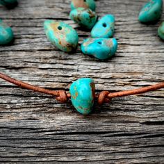 "Every day is a good day to \"rock\" your turquoise! Each American mined turquoise bead is from the Kingman mine in AZ. Though, no two pieces of turquoise are the same. So the exact shade, shape, & matrix will vary from stone to stone. The stones are tied on a 2mm rolled leather necklace. This simple, yet fun turquoise choker is adjustable to any length up to 28.\"" Turquoise Jewelry Necklace, Long Leather Necklace, Turquoise Choker, Treasure Jewelry, Logo Jewelry, Faith Jewelry, Necklace Leather, Cord Jewelry, Leather Chokers