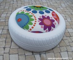 an inflatable bed is sitting on the ground with flowers and circles painted on it