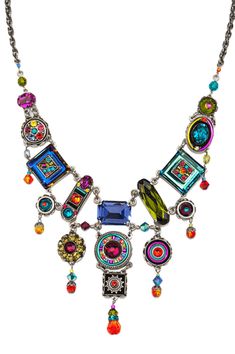 This intricately embellished mosaic jewelry is inset with a combination of Austrian Swarovski crystals and Czech glass beads. Iridescent and colorful. Oranges, pinks and purples. Lobster style clasps Oxidized silver plate over brass Necklace is 16" Pendant measures 1/2" square with a span of 6" 8300-MC La Dolce Vita Collection Firefly Jewelry specializes in elegant designs, innovative colors mixes and meticulous workmanship. Firefly uses filigree findings made from vintage molds, which give th Firefly Jewelry, Vintage Molds, Jewelry Assemblage, Czech Jewelry, Pink Circle, Weird Jewelry, Jewelry Repurposed, Mosaic Jewelry, Whimsical Jewelry