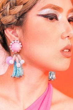 These bubbly earrings in pink and blue are so pretty, it's true. With bubblegum ball studs, and purple rhinestone candy orbs, these earrings are good enough to eat. Wear it on your birthday, or just about any holiday. You'll look oh-so-yummy everyday. The Birthday Cake tassel earrings are part of our Retro Candy Shop Collection inspired by the retro era of colorful fashion. Rewind to the nostalgic days with our eye-candy earrings in different flavors to wear with your bold print dress. A little bit of retro to your style makes the world sweeter and a little more vibrant. Playful Purple Party Earrings, Pink Clip-on Jewelry For Party, Playful Jewelry With Matching Earrings For Party, Playful Blue Jewelry For Party, Glamorous Pink Earrings For Celebration, Playful Pink Earrings For Party, Playful Purple Jewelry For Party, Playful Purple Party Jewelry, Party Jewelry With Pink Dangling Beads