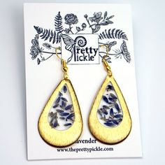 "Lavender Teardrop Earrings These earrings feature real pressed lavender buds, encased in resin, in a bright brass teardrop shaped setting. Attached to matching hooks and each measures 1.75\" x 1\"" Gift Brass Teardrop Drop Earrings, Gold Teardrop Birth Flower Earrings, Pressed Lavender, Flower In Resin, Drop Gold Earrings, Megan Brown, Mustard Seed Necklace, April Birth Flower, Lavender Buds