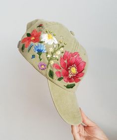 Hand embroidered hiking hat with floral design / baseball hat for women Color: khaki baseball cap.Design: hand-embroidered gerbera with wildflowers.Cap size (head circumference): 55 - 67 cm.The quality of the embroidery and baseball cap is superior, I guarantee! ;)I really enjoyed making this, and I hope my customers will enjoy showing it off.🌿PLEASE NOTE I NEED 2 WEEKS TO EMBROIDER THIS HAT FOR YOU🌿CHECK OUR OTHER ACCESSORIES🌸 More Baseball hats:https://www.etsy.com/shop/KazkovaEmbroidery?re Khaki Visor Hat For Spring, Embroidered Outdoor Baseball Cap, Embroidered Trucker Hat For Outdoor, Outdoor Embroidered Trucker Baseball Cap, Khaki Visor Baseball Cap For Spring, Embroidered Snapback Baseball Cap For Outdoor, Outdoor Spring Snapback Hat With Curved Visor, Spring Outdoor Baseball Cap With Embroidered Logo, Embroidered Adjustable Baseball Cap For Outdoor