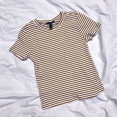 Features: 100% Cotton Fitted Short Sleeve T Shirt New With Tags (Nwt) With Banded Crew Neck Collar. Black, White, And Yellow Horizontal Stripes. Very Soft And Comfortable. Size: S Condition: Great Preowned Condition! Little To No Signs Of Wear No Flaws Follow Me @Second_act_closet On Ig!! Tags: Casual, Everyday Wear, Eras Tour, Concert, Taylor Swift, Midnights, Fearless (Taylor’s Version) Casual Striped Tops From Forever 21, Forever 21 Striped Cotton Tops, Forever 21 Yellow Cotton Top, Trendy Yellow Forever 21 Tops, Forever 21 Yellow Casual Top, Concert Taylor Swift, Light Pink Bodysuit, Ig Tags, Bodysuit With Shorts