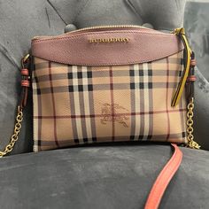 This Is An Authentic Burberry House Check Crossbody Cbag In Pink. This Stylish Bag Is Crafted Of Burberry Signature House Check Coated Canvas With Pink Leather Trim. The Bag Comes With A Crossbody Pink Leather Shoulder Strap With Gold Hardware .The Top Zipper Opens To A Black Fabric Interior With A Pink Leather Card Panel. Burberry Pink, Pink Horse, Stylish Bag, Burberry Bag, Pink Leather, Leather Trim, Black Fabric, Leather Trims, Gold Hardware