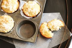 four muffins in a metal pan on top of a table