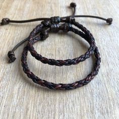 "Dark Brown Leather matching bracelets These lovely bracelets are made with genuine braided leather cord. Designed for couples The \"hers\" bracelet closes to 6.5\" and the \"his\" bracelet closes to 7\"; however, both bracelets are adjustable and they fit up to 7.5\" Includes Gift Box Please feel free to contact me if you have any questions These bracelet will be shipped by USPS First Class as soon as the payment is been received For more Couple's Bracelets: https://www.etsy.com/shop/Fanfarria? Brown Leather Braided Bracelet As Gift, Brown Leather Strap Braided Bracelet Gift, Handmade Brown Leather Bracelet Adjustable Fit, Brown Leather Braided Bracelet, Brown Braided Leather Bracelets, Brown Leather Braided Jewelry, Brown Braided Leather Jewelry, Braided Brown Leather Jewelry, Bohemian Brown Leather Bracelet With Sliding Knot