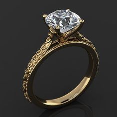 a gold engagement ring with a diamond in the center and filigrees on the sides