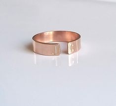 "Dainty and beautiful, this open 14 kt rose gold-filled personalized initial ring is great by itself or stacked. On each end you can have your first and last initials engraved, or simply the first initial of you and your loved one!! Approximately 4mm wide. Please don't forget to leave a message in the \"note to seller\" field upon checkout letting me know the two initials that you would like to have stamped. The font I use is upper case Arial. If you would like your initials to be in lower case Engraved Initials Promise Ring In Rose Gold, Rose Gold Initials Promise Ring, Rose Gold Promise Ring With Initials, Personalized Rose Gold Round Ring, Rose Gold Open Ring With Initial For Anniversary, Personalized Rose Gold Ring Jewelry, Rose Gold Initial Ring With Custom Name For Promise, Custom Name Rose Gold Initial Ring For Promise, Rose Gold Promise Ring With Custom Name