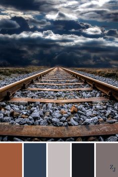 a train track that is going through the sky with clouds in the background and some colors to choose from