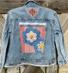 Washed and distressed denim jean jacket embellished with vintage quilt blocks and other fun fabrics and a bit of lace.  Size M.  It's 20" across the chest.  One of a kind. Applique Jean Jacket, Retro Cotton Patchwork Denim Jacket, Retro Patchwork Denim Jacket, Retro Cotton Denim Jacket With Patchwork, Cotton Denim Jacket With Patchwork In Medium Wash, Medium Wash Cotton Denim Jacket With Patchwork, Vintage Denim Patchwork Outerwear, Vintage Patchwork Denim Jacket In Medium Wash, Vintage Patchwork Medium Wash Denim Jacket