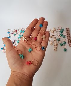 These cool braid rings are the perfect hair accessory! Perfect in short or long hair, highlighting braids, buns and ponytails. A great accessory to add with any outfit! Dress up or wear with jeans. A must-have hair accessory for the beach! SET OF 10 PCS MATERİAL 1- COOPER RİNG -EVİL EYE BEADS 2-COOPER RİNG- COLORED WOODEN BEADS 3-COOPER RİNG- STAR TURQUOİSE BEADS 4- THİCK COOPER RİNG hammered 5-COOPER RİNG- Rose plated leaf 6-COOPER RİNG-red color turkuoise star 7-COOPER RİNG- white color turkuo Hollow Hair Rings, Hair Rings Wedding, Ring On Hair Gender, Hair Rings Short, Hollow Out Hair Ring, Cute Hair Rings, Hair Charm Rings, Heart Hair Ring, Braid Rings