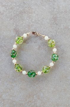 "Gold Filled and Luminous Crackle Glass Handmade Beaded Bracelet, 7.5\". All 4mm round beads and lobster clasp are gold filled. Green beads are 12mm crackle glass glow in the dark beads.  Spacer beads are teal glow in the dark beads. Really pretty bracelet during day as well as at night! Check out my other jewelry at https://loveofjewelryshop.etsy.com" Green Nickel Free Bracelets With Round Beads, Green Bracelets With Charms And Round Beads, Green Polished Bead Bracelet, Green Glass Round Bead Bracelets, Glow In The Dark Beaded Bracelets, Green Round Beads Bracelet, Nature-inspired, Nickel-free Green Beaded Bracelets, Fun Bracelet, Hippie Bracelets