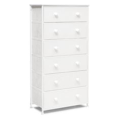 a white dresser with five drawers and four knobs