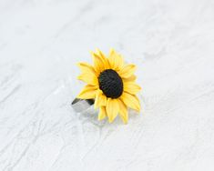 Sunflower Flower Ring This is such a beautiful sunflower ring for those who love this flower. Handcrafted, this ring will undoubtedly be the perfect gift for all occasions. Flowers are made by hand from polymer clay, not fragile, strong, not afraid of water. READY TO SHIP ❀ Dimensions: - Flower size about 1.18 inches (3 cm) - Ring's size is adjustable from size 7,5 US (17,7 mm) and up ❀ Materials: - Polymer clay - Ring base stainless steel - do not darken ❀ All the jewelry I pack in a gift box, Adjustable Yellow Flower Ring For Gift, Adjustable Sunflower Design Flower Ring Gift, Sunflower Design Flower Ring For Gift, Poppy Ring, Botanical Ring, Polymer Clay Ring, Sunflower Ring, Polymer Clay Flowers, Floral Necklace