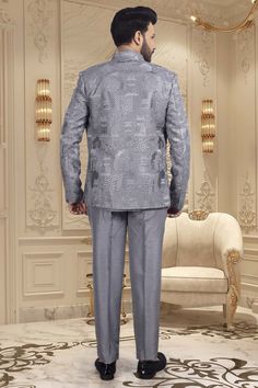 This elegant short sherwani is a luxurious addition to any gentleman's wardrobe. With a beautifully crafted thread embroidery open jacket, this mens sherwani exudes sophistication and exclusivity. Perfect for special occasions and formal events, it is the epitome of refined style. Elevate your look with this M42-S117 sherwani. Elegant Tailored Festive Kurta, Elegant Tailored Nehru Jacket For Eid, Tailored Elegant Formal Kurta, Formal Fitted Nehru Jacket With Naqshi, Elegant Nehru Jacket With Naqshi For Formal Occasions, Elegant Tailored Sherwani For Eid, Elegant Gray Sets With Zari Work, Elegant Gray Kurta For Eid, Festive Elegant Suits With Naqshi Detailing