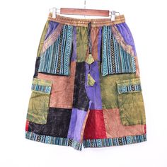 Discover the ultimate in bohemian style with our "Unisex Boho Patchwork Cargo Shorts," meticulously handcrafted to bring you the perfect blend of functionality and fashion. Made from 100% cotton, these shorts ensure maximum comfort and breathability, making them ideal for the summer heat or music festivals. Measurements: S/M Waist unstretched= 28 inch Waist stretched = 44 inch inseam = 9 inch L/XL waist unstretched = 30 inch waist stretched = 48 inch inseam = 10 inch Each pair showcases a unique Hippie Summer, Short Cargo, Boho Patchwork, Summer Apparel, Colorful Bohemian, Bohemian Festival, Bohemian Colors, Cooler Look, Shorts Cargo