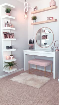 a white desk with a mirror, shelfs and a plant on top of it