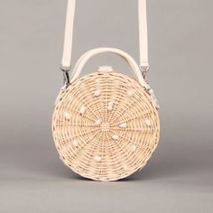 The round handbags are made of 100% natural straw, so they are durable and do not lose their shape. This amazing summer bag is created in collaboration with Galian Studio.  natural pearls 100% natural straw  natural linen lining  shoulder strap which you can take off inside pocket Dimensions of this women's purse with pearls: height: 21 cm  width: 21 cm depth: 9 cm  shoulder strap: 115 cm White Shoulder Bag For Summer Picnics, Summer Cream Shoulder Bag With Pearl Handle, Cream Shoulder Bag With Pearl Handle For Summer, White Shoulder Bag With Round Handle For Summer, Summer Vacation Round Shoulder Bag, White Straw Bag With Bamboo Handle For Summer, Summer Beige Shoulder Bag With Pearl Handle, Natural Bags With Pearl Handle For Summer, Round Shoulder Bag For Everyday Use In Summer