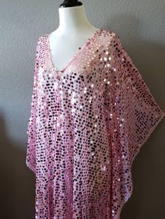 Made to order...Pink Sequin Caftan DressLarge iridescent round sequinPink Sheer lightweight fabricOversized kimono style sleevesOne Size Fits MeasurementsWidth: 46" (armpit to arm pit)Total Length : 50-56" CareHand Wash Cold Please allow me 2-3 business days to make the item prior to shipping. Sequin Caftan, Oversized Kimono, Maxi Party Dress, Pink Sheer, Pink Round, Caftan Dress, Kimono Style, Pink Sequin, Maxi Dress Party