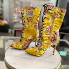 Brand New Never Worn Multicolor High Heel Spring Boots, Multicolor High Heel Boots For Spring, Multicolor Floral Print Boots For Summer, Trendy Yellow Winter Boots, Spring Gold Pointed Toe Heeled Boots, Gold Pointed Toe Heeled Boots For Spring, Multicolor Floral Print Summer Boots, Spring Floral Embroidered Multicolor Boots, Yellow Fitted Boots With Round Toe