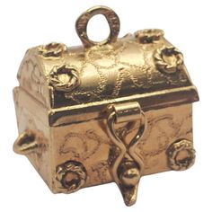 Beautiful vintage treasure chest charm/pendant featuring hidden pearl treasure inside. The chest is hinged and has a figure eight system to hold it closed. The bottom is engraved with the date 12-25-66. This chest would make an adorable pendant or could be worn on a bracelet as a charm by a vintage jewelry lover. Vintage Treasure Chest, Buy List, Hidden Treasure, Treasure Chest, Hidden Treasures, Jewelry Lover, Charm Pendant, Vintage Jewelry, Jewelry Bracelets