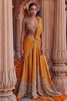 Mustard pre-draped skirt saree with attached pleated draped pallu, all over scattered, floral pattern, contrast cut dana, sequin, sippi, metal and cotton thread embroidery. Paired with jaal embroidered blouse. - Aza Fashions भारतीय दुल्हन संबंधी, Skirt Saree, Haldi Outfits, Sangeet Outfit, Function Dresses, Draped Saree, Simple Lehenga, Pakistani Formal Dresses, Floral Lehenga