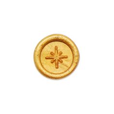 a gold button with an arrow on it