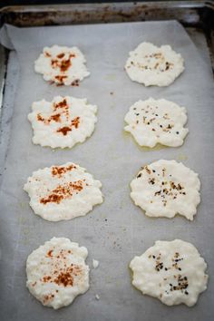 some food that is sitting on a baking sheet and ready to be baked in the oven