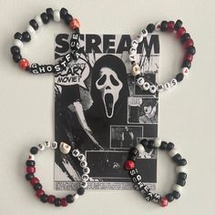 Hand made bracelets inspired by the horror movie Scream. Clay Bead Bracelet Ideas Scream, Punk Kandi Bracelets, Little Brother Christmas Gifts, Ghost Face Bracelet, Horror Beaded Bracelet, Scream Bracelet Ideas, Horror Movie Bracelets, Horror Movie Beaded Bracelet, Character Themed Bracelets