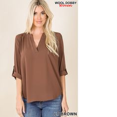 Stay Stylish And Warm This Season With This Women's Wool Dobby Blouse With Button Sleeves. Made With A Soft And Cozy Wool Dobby Fabric, This Blouse Features A Classic Button-Sleeve Design For A Versatile Look. The Relaxed Fit And Round Neckline Create A Comfortable And Flattering Silhouette, Making It A Great Choice For Both Work And Play. Available In Various Colors, This Wool Dobby Blouse Is A Must-Have For Any Winter Wardrobe. Brown V-neck Blouse For Office, Brown V-neck Blouse With Button Closure, Light Blue Blouse, Dobby Fabric, Button Sleeves, Flowy Shirt, Front Tie Shirt, Rhinestone Belt, Yellow Blouse