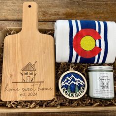 a wooden cutting board with some food in it and a towel on the table next to it