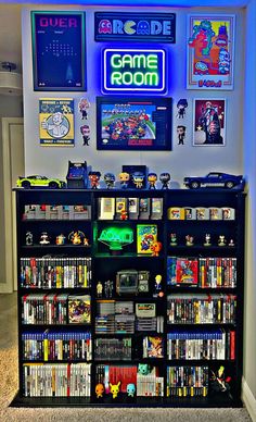 a video game room with various games on the shelves