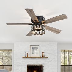 a living room with a fire place and a ceiling fan that is hanging from the ceiling