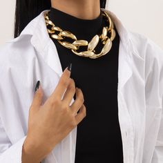 Exude elegant vibes when you wear this gold choker that features knots that link together for a classic look. 2.2'' W x 16 '' L with 2.7'' extender Lobster claw clasp Goldtone copper Trendy Gold Plated Chain Necklace For Formal Events, Trendy Gold Plated Chain Necklace For Formal Occasions, Gold Metal Chain Choker Necklace, Elegant Gold Chain Link Choker, Gold Metal Chain Choker, Gold Chunky Chain Link Choker, Gold Chunky Chain Choker For Party, Gold Clavicle Chain Costume Choker, Gold Chain Link Choker For Party