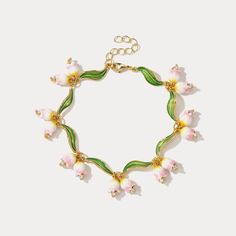 Elevate your look with our Flower Enamel Bracelet, crafted with a beautiful enamel for a luxurious touch and classic style. Lasting quality and unique design make this bracelet the perfect accessory for special occasions or everyday wear. DETAILS Plating: 18k Gold on Brass Materials:   18K Gold on Brass, Freshwater Pearl Measurements: Length: 7.48"(19.0cm) + Extender: 1.57"(4.0cm) Weight:  26.84g Kali Aesthetic, Cutesy Jewelry, Lily Of The Valley Jewelry, Pink Lily Of The Valley, Lily Of The Valley Flowers, Slouch Socks, Hand Necklace, Opal Pendant Necklace, Heart Hoop Earrings