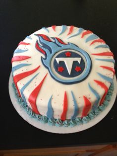 a cake decorated with red, white and blue icing on top of a table