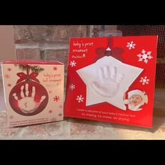 two christmas cards with handprints on them, one for baby's first christmas