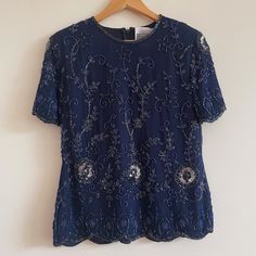 vintage navy blue beaded top embellished boho silk blouse tee sparkle party  heavy weighted fabric, beautiful detail measurements  Bust 88cm Waist 78cm Length 59-61cm good vintage condition always happy to combine postage Elegant Navy Short Sleeve Tops, Elegant Short Sleeve Embellished Blouse, Elegant Embellished Short Sleeve Blouse, Fitted Blue Embellished Blouse, Blue Fitted T-shirt For Party, Vintage Embroidered Party Tops, Vintage Embroidered Tops For Parties, Festive Blue Sequined Tops, Festive Blue Sequin Tops