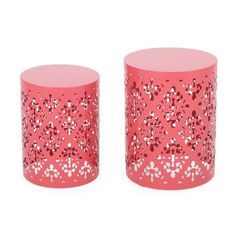 pair of pink glass side tables with floral design on the top and one in red