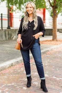 Switch up your style with this top! Featuring button detailing on the bust and sleeves, this lightweight henley-style knit top is perfect for adding some flair to your wardrobe. Stand out from the crowd and tell your own unique story with this playful and fun top! 96% Rayon, 4% Spandex Fall Henley Neckline Tops With Button Cuffs, Casual Long Sleeve Top With Buttons For Fall, Casual Henley With Button Cuffs For Fall, Casual Long Sleeve Top With Button Closure For Fall, Casual Black Henley For Fall, Casual Henley Blouse For Fall, Casual Henley Neckline Long Sleeve Top For Fall, Casual Henley Neckline Blouse For Fall, Casual Henley Neckline Blouse With Buttons