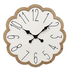 a wooden clock with numbers on the front and back of it's face is shown